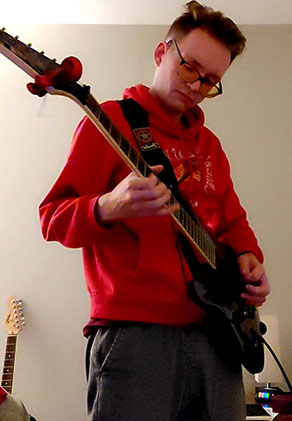 Noah Lemke playing a guitar